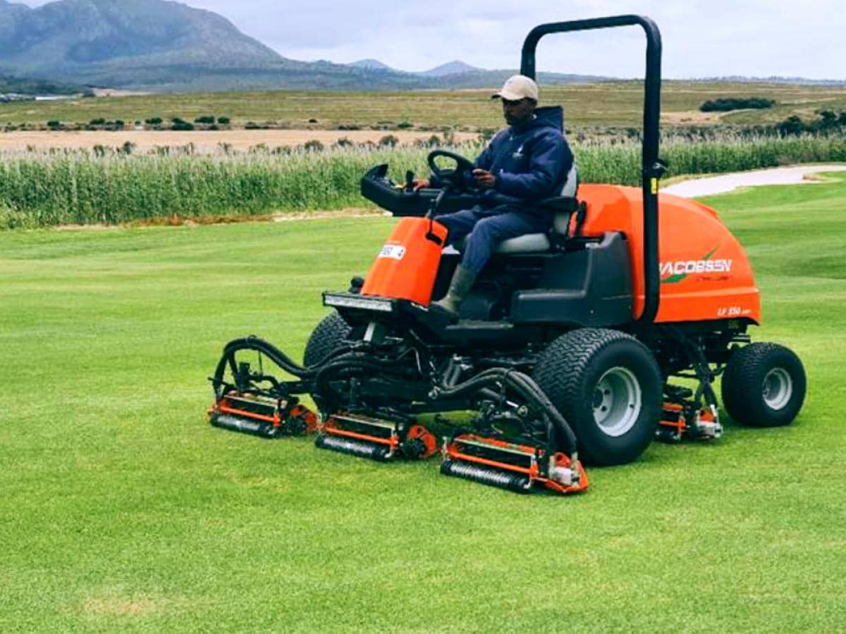 Technician sharpening a reel