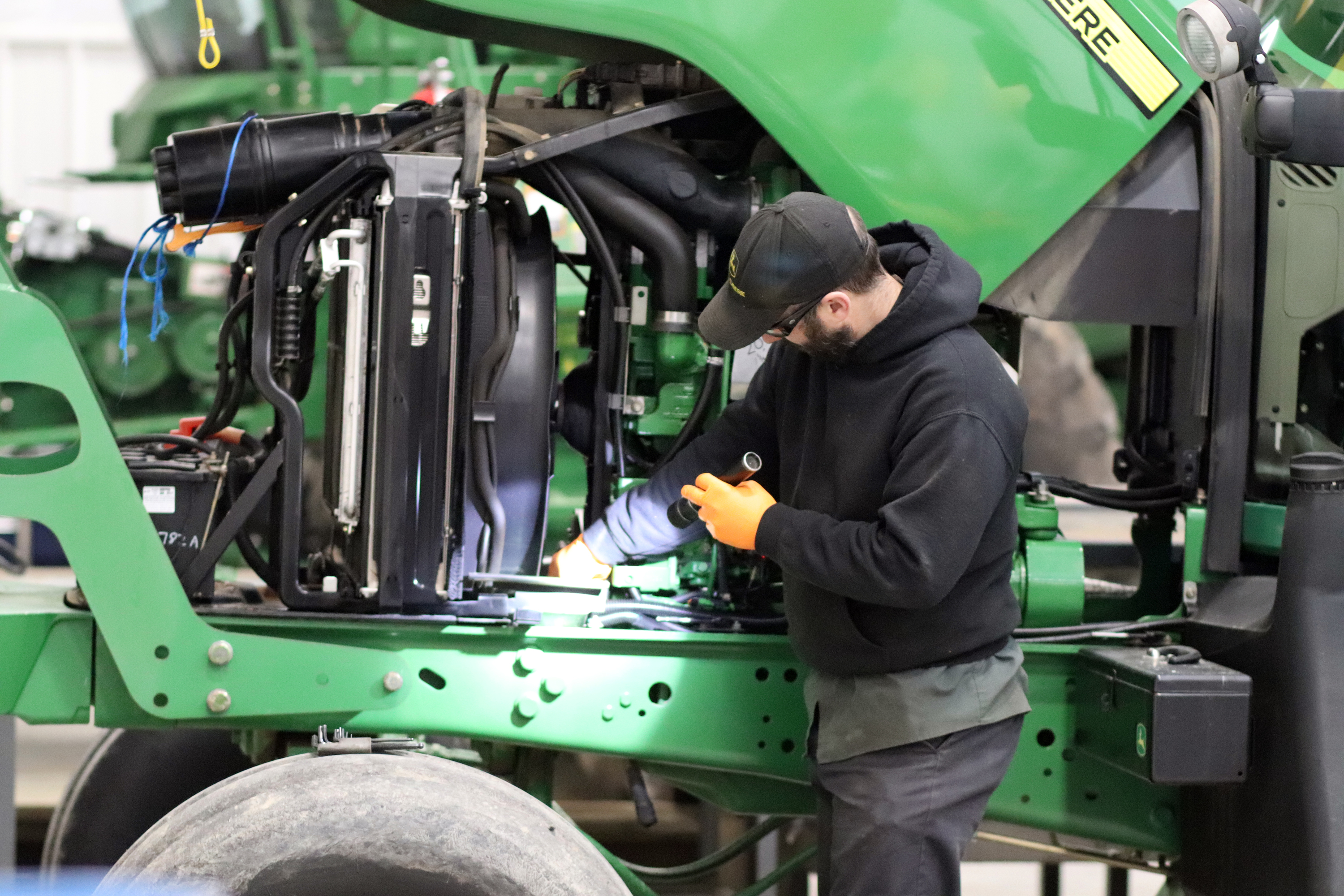 Technician sharpening a reel